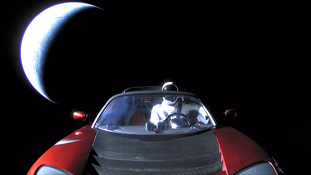 picture of the roadster in the space, and the moon in backgound